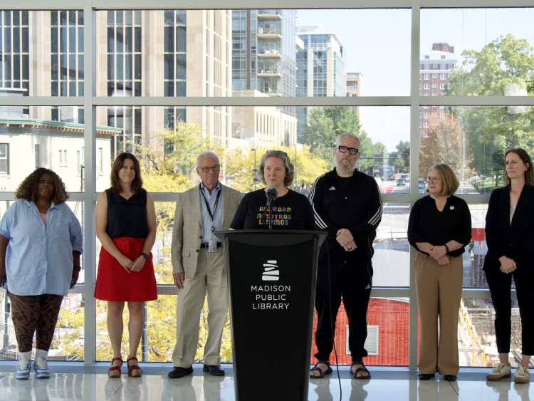 Mayor Rhodes-Conway speaking in front of city officials at the Central Library