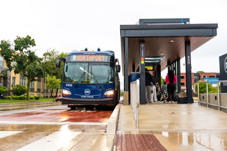 BRT bus pulling up to a statiojn