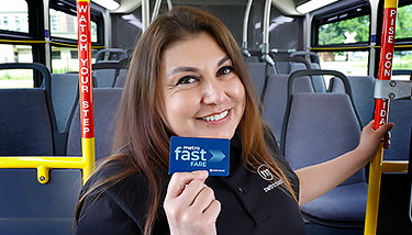 Driver holding a Fast Fare card