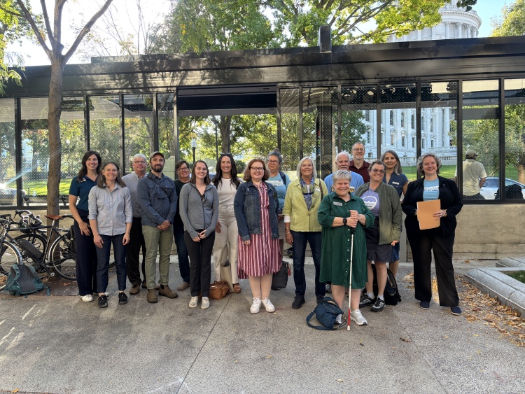 Community leaders and representatives ride a Bus Rapid Transit (BRT) bus together