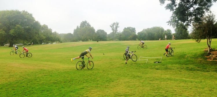 bike riders in mowed field