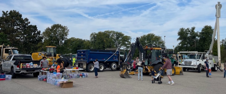 big trucks, parking lot, people