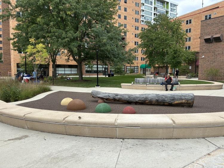 urban park - capitol centre park with nature play area, trees, concrete seating
