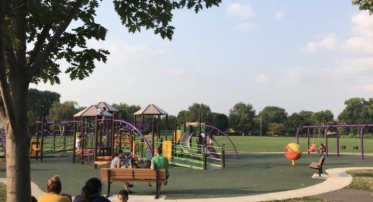 people enjoying the accessible playground at Brittingham Park