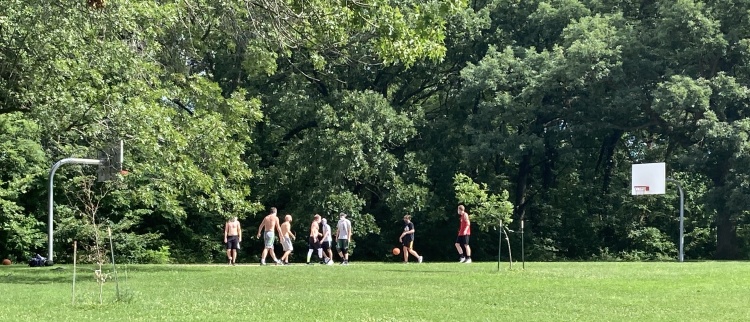 Adults playing on the Hoyt Park basketball courts 