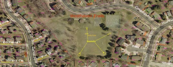 There are four disc golf baskets, roughly in the four corners of the open field area of the park