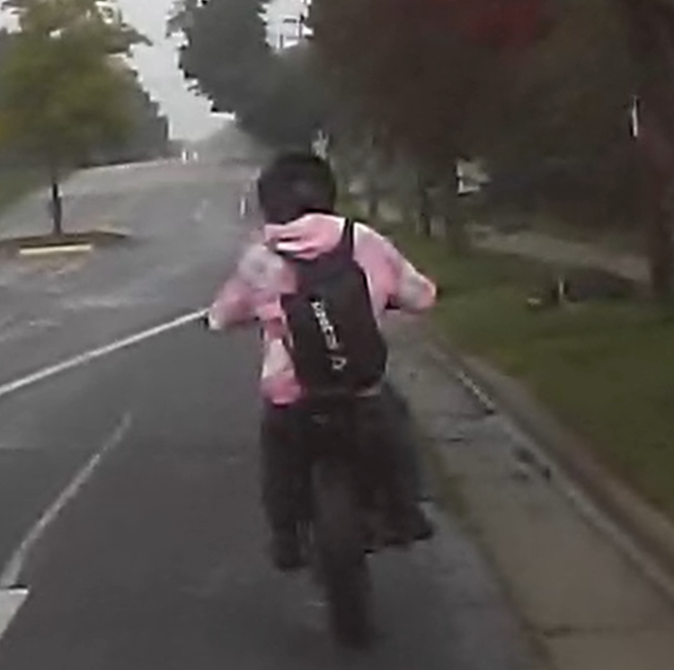 A driver on a motorcycle flees from police on a road in Madison.