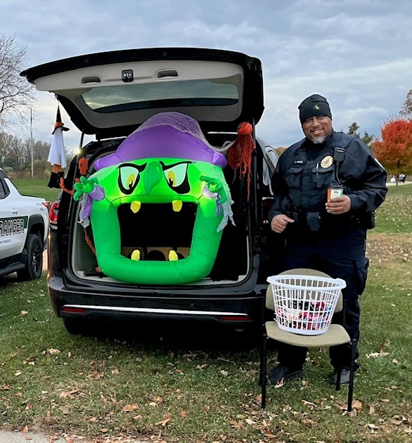 Officer Lester Moore in attendance at a North District Trunk or Treat Event