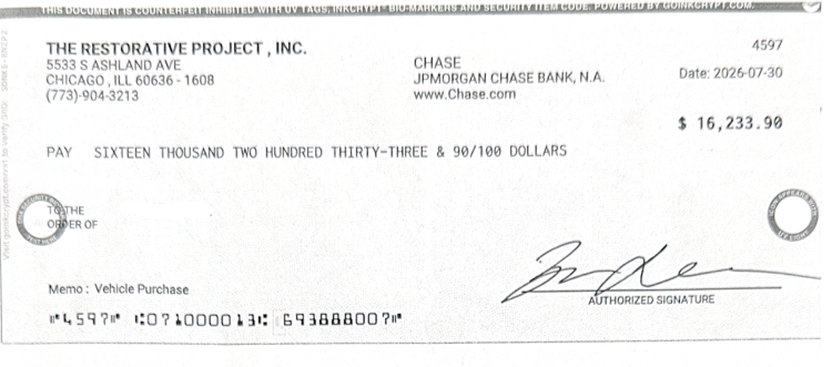 A copy of a fraudulent check used to buy several luxury vehicles. 