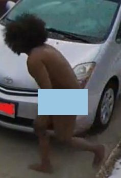 Naked suspect attempts to break into vehicle.