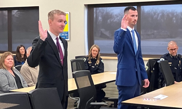Madison police recruits take an oath of office as they are sworn-in to the Accelerated Academy