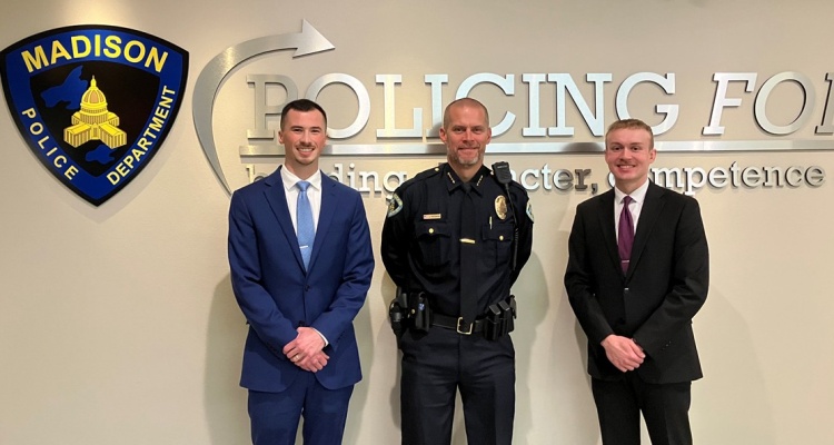 Officers in the Accelerated Academy stand next to Madison Police Chief John Patterson.
