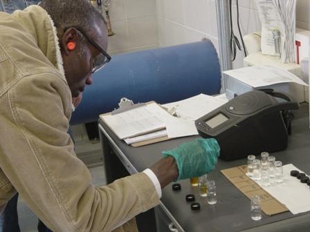 Water Utility employee tests water sample