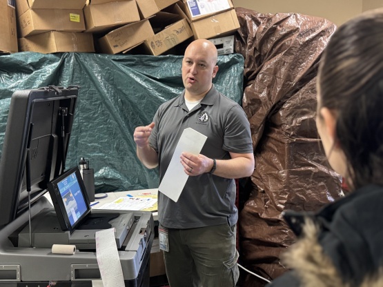 Deputy Clerk Jim Verbick tests a ballot tabulator