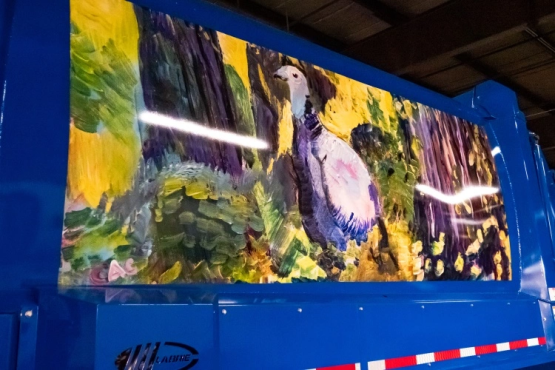 A mural of a turkey painted onto a collection truck