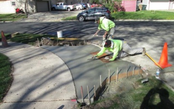 City crew repairing a sidewalk in Madison