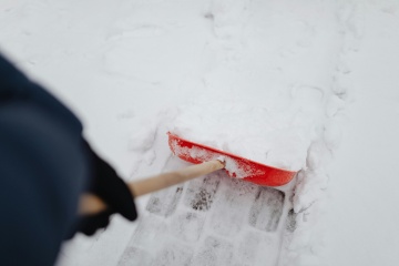 photo shoveling snow