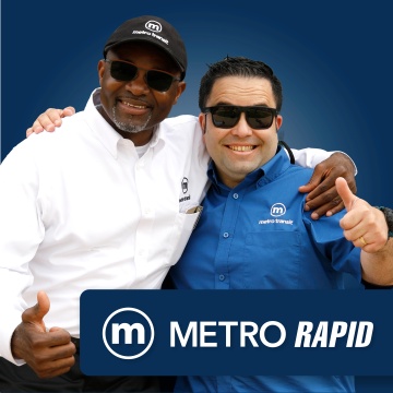 Two Metro drivers; showcasing BRT launch