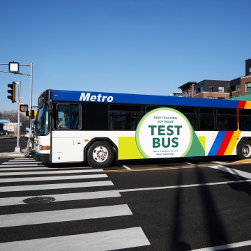 bus with test bus advertisement on it 