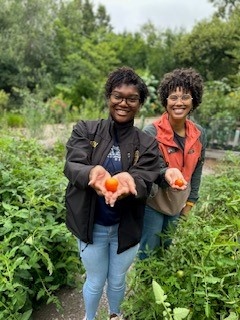 MPD Officer Lillie Brown rolled up her sleeves and learned about what keeps Olbrich Botanical Gardens operational with Sarah Ellis, Community Education & Engagement Specialist