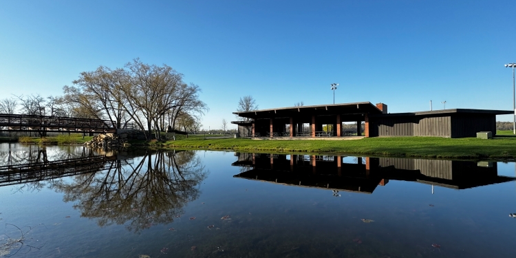 vilas park shelter and blue sky reflecting in lagoon