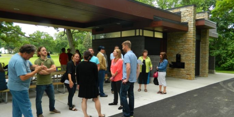 People celebrating ribbon cutting at Lake Edge Park Shelter.