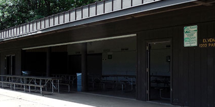 Shelter with trees in background.