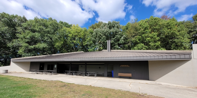 Shelter with trees in background.