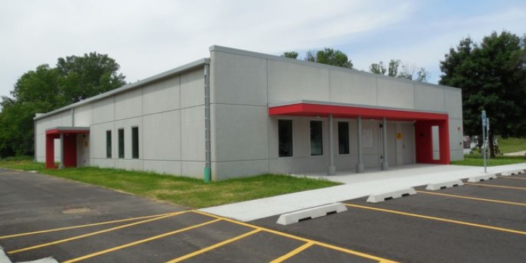Parking lot, sidewalk, and shelter.