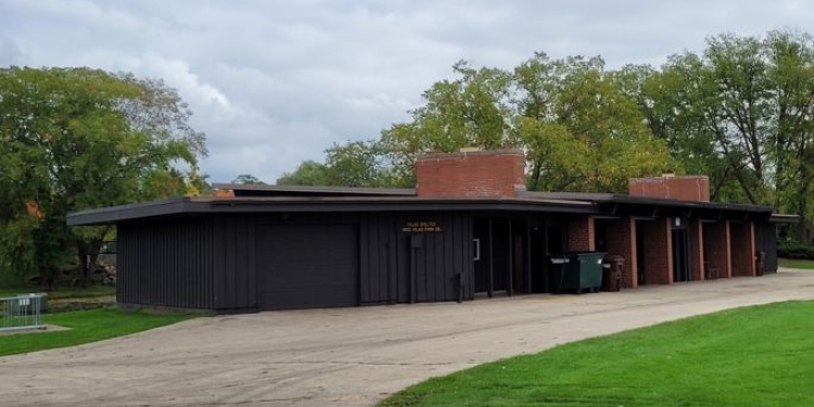 Shelter with paved drive and grass.