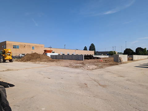 This is a photo of the construction progress of the salt facilities at 1501 W. Badger Rd.  There's concrete footings in place, and stacks of wooden beams waiting to be stood up.
