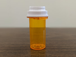 Empty plastic prescription bottle